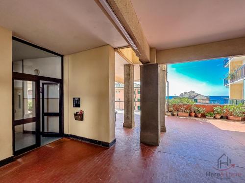 an open hallway with a view of a building at Modern Blue Horizon - Spiagge 200m - AC - SmartTV in Cogoleto