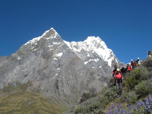 a group of people riding bikes up a mountain at HUAYHUASH TREK HOTSPRINGS start and finish in hotsprings 10 days one night purchase valued in 10 days trekking in Huaraz