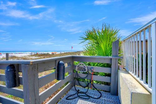 a balcony with a fence with the beach in the background at Shoalwater 703 by Liquid Life in Orange Beach