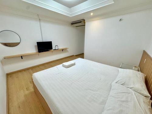 Ένα ή περισσότερα κρεβάτια σε δωμάτιο στο Pophouse