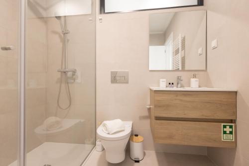 a bathroom with a shower and a toilet and a sink at Encanto da Foz - BY SCH in Foz do Arelho