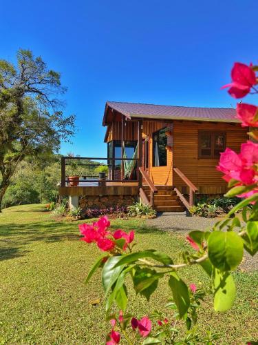 Taman di luar Cabana com visual incrível para a Serra