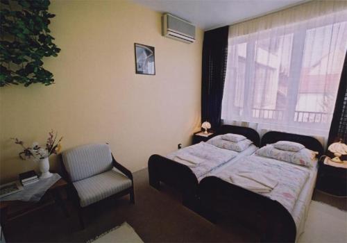 Un pat sau paturi într-o cameră la Hotel Uno