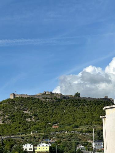 a hill with a castle on top of it at Aurela Apartment in Lezhë