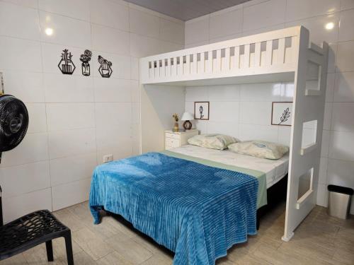 Ένα ή περισσότερα κρεβάτια σε δωμάτιο στο Buona Notte Hostel & Pousada