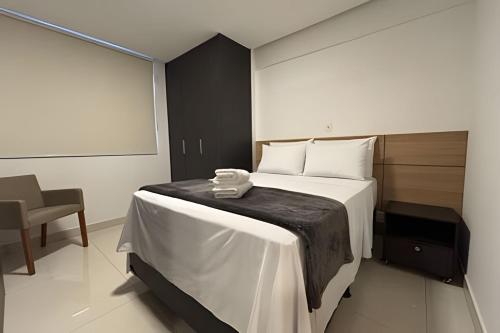 En eller flere senge i et værelse på LUX80 - Flat Próximo ao Órion Alto Padrão