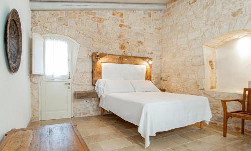 Ένα ή περισσότερα κρεβάτια σε δωμάτιο στο Masseria dei Preti
