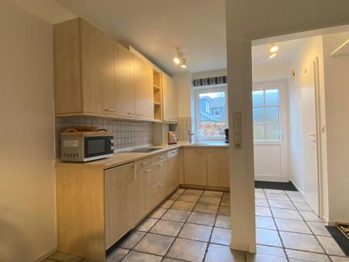Kuchyň nebo kuchyňský kout v ubytování Ferienhaus Anlage Ostland17 Dörpstern Nordseeland17 e