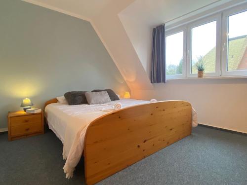 Postel nebo postele na pokoji v ubytování Ferienhaus Anlage Ostland17 Dörpstern Nordseeland17 e