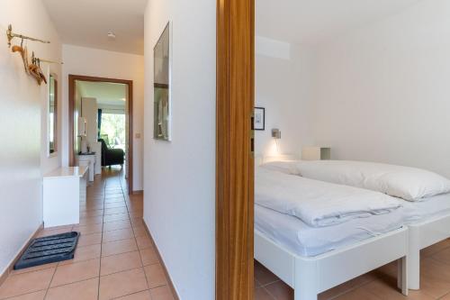 Ένα ή περισσότερα κρεβάτια σε δωμάτιο στο Villa Anna II App 71