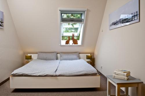Postel nebo postele na pokoji v ubytování Haus Strandaster OG
