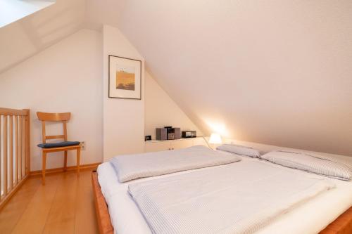 Ένα ή περισσότερα κρεβάτια σε δωμάτιο στο Wohnung Zum Leuchtturm