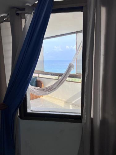 a window with a view of the ocean from a room at Vista al Mar in Caraballeda
