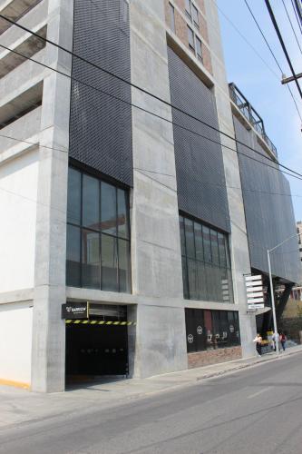 a large building on the side of a street at Departamento Zona Centro in Monterrey
