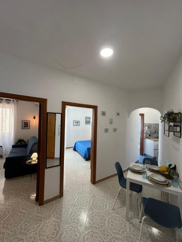 a living room with a table and a couch at Massi's House - Cozy & New in Maiori