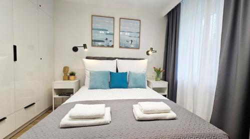 Ένα ή περισσότερα κρεβάτια σε δωμάτιο στο Mini Apartament Lipperta