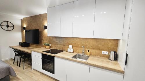 Η κουζίνα ή μικρή κουζίνα στο Mini Apartament Lipperta