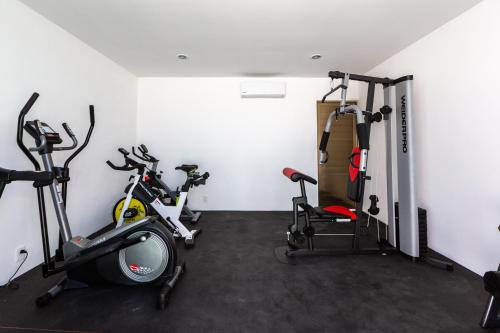 a gym with two exercise bikes in a room at central and quiet apartment playa in Playa del Carmen