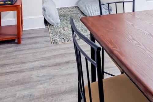 a wooden table and chairs in a living room at Luxury Beach Getaway in Cape Charles in Cape Charles
