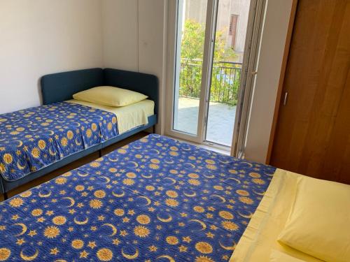 Posteľ alebo postele v izbe v ubytovaní Marko Apartment