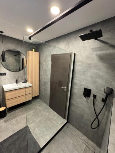 a bathroom with a shower and a sink at Villa Gaga in Dubrovnik