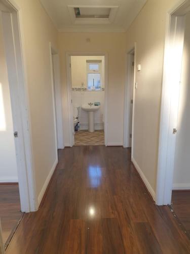 an empty room with a bathroom and a sink at Staycation Bunglaw in Coppingford