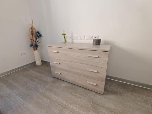 a dresser in the corner of a room at Cozy Double Room with Private Bath Pembroke in Pembroke 