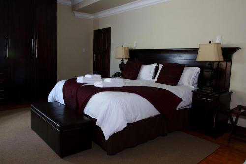 Кровать или кровати в номере Goodey's Guesthouse