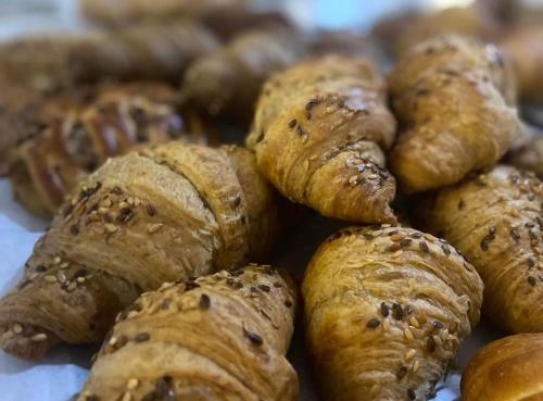 a pile of pastries sitting on top of a table at l'angolo di Gaudì, alcoba Fascinosa in Putignano