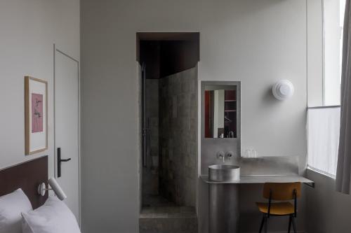 Postel nebo postele na pokoji v ubytování Hotel Pilar