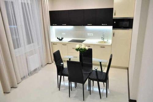 Η κουζίνα ή μικρή κουζίνα στο Apartments Tatiy