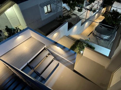 an overhead view of a building with stairs and a car at Apartments Klajdi in Sarandë