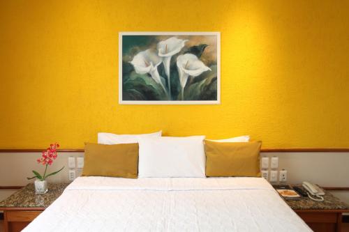 Katil atau katil-katil dalam bilik di Mengo Palace Hotel