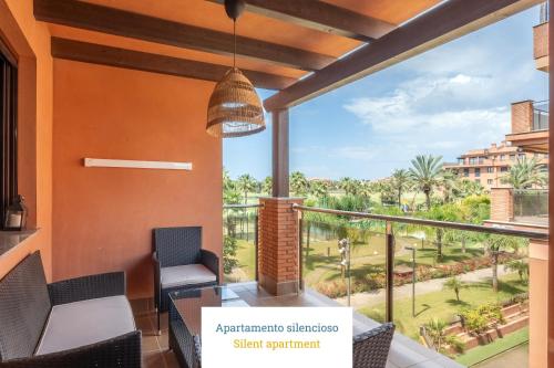 a balcony with a view of the resort at Homity Holidays - Playa Granada - Dos Mares in Motril