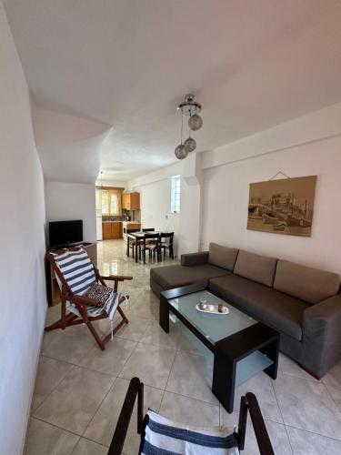 a living room with a couch and a table at Anestis House in Anaxos