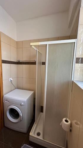 a bathroom with a washing machine and a washer at Anestis House in Anaxos