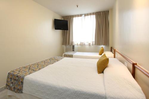 Katil atau katil-katil dalam bilik di Mengo Palace Hotel