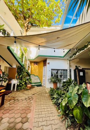 a courtyard of a building with plants at Palmar la Punta 8 AC Starlink 2min walk to beach in Brisas de Zicatela