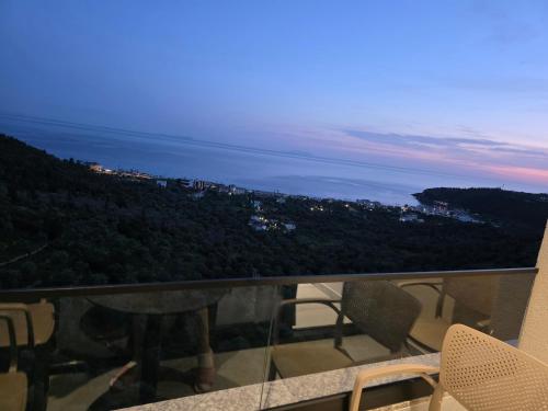a view of the ocean from the balcony of a house at Wait 'n Sea in Himare