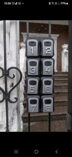 a black and white calculator on the side of a building at Viktoriya Family 2 Country complex in Kyiv