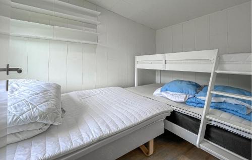 two bunk beds in a room with white walls at Nice Home In Eskebjerg With Wifi in Eskebjerg