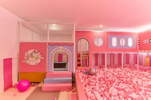 a pink room with a lot of pink balls at Leshwa House 1 in Nairobi