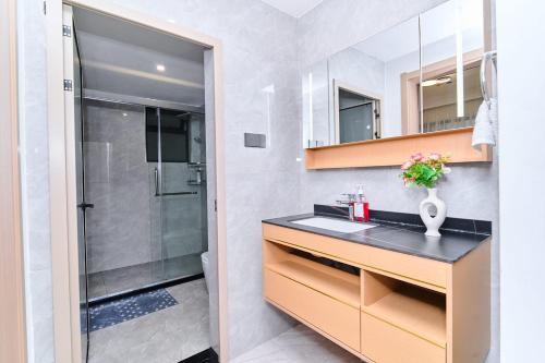 a bathroom with a sink and a shower at Leshwa House 1 in Nairobi