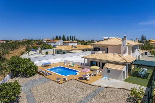 an aerial view of a house with a swimming pool at Villa Casa Grande by Villa Plus in Albufeira