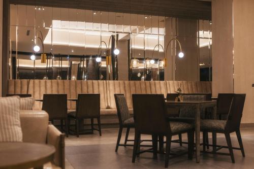 a dining room with a table and chairs at Hotel Cabo De Hornos in Punta Arenas