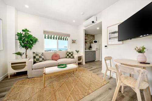 a living room with a couch and a table at Pismo Beach Club in Pismo Beach