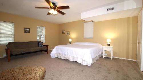a bedroom with a bed and a ceiling fan at Relaxing Beginnings in Cape May Point