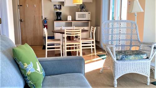 a living room with a couch and chairs and a table at Somewhere In Time Unit 4 in Cape May Point