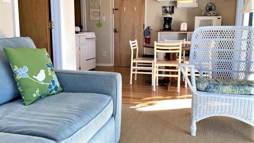 a living room with a couch and chairs and a table at Somewhere In Time Unit 4 in Cape May Point