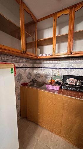 a kitchen with a sink and a counter top at Miramar GuestHouse in Taghazout